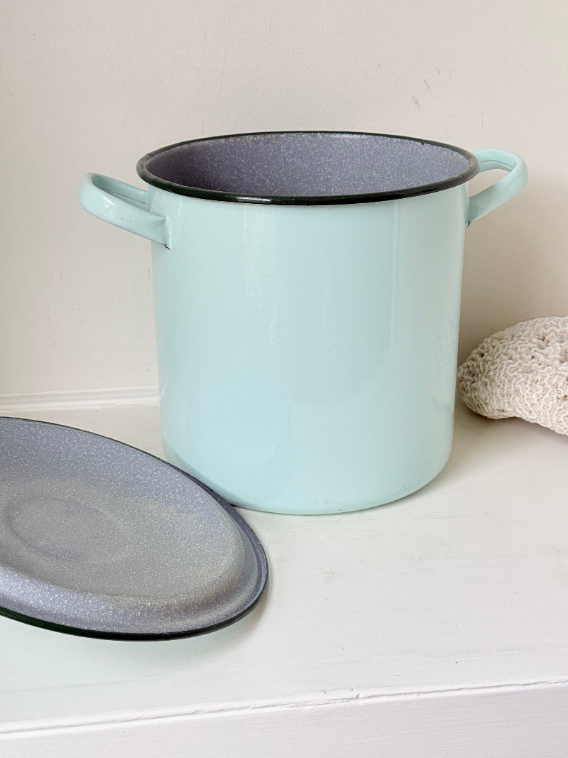 Vintage pale blue enamel bread bin with lid and handles, photographed on a white surface