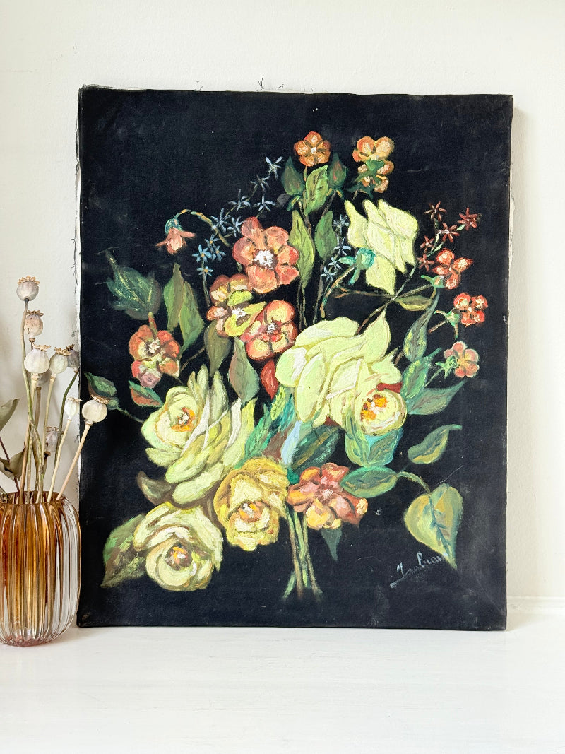 Vintage floral still life oil on canvas with yellow and peach blooms against dark background, unframed, on white surface.