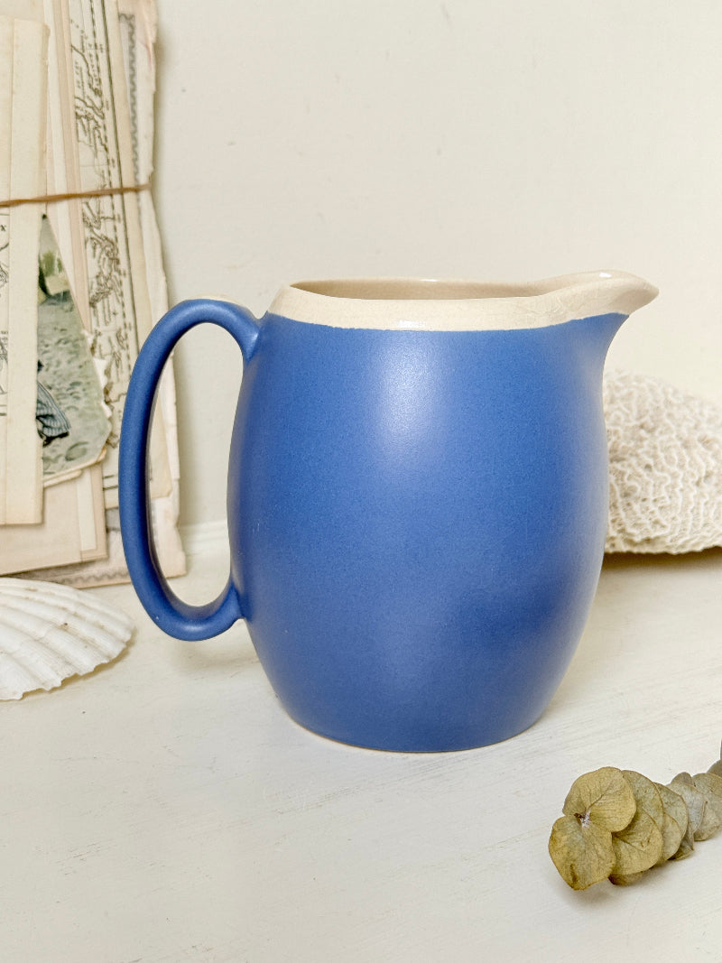 Vintage cornflower blue glazed stoneware jug with cream interior, pulled spout and curved handle for kitchen styling