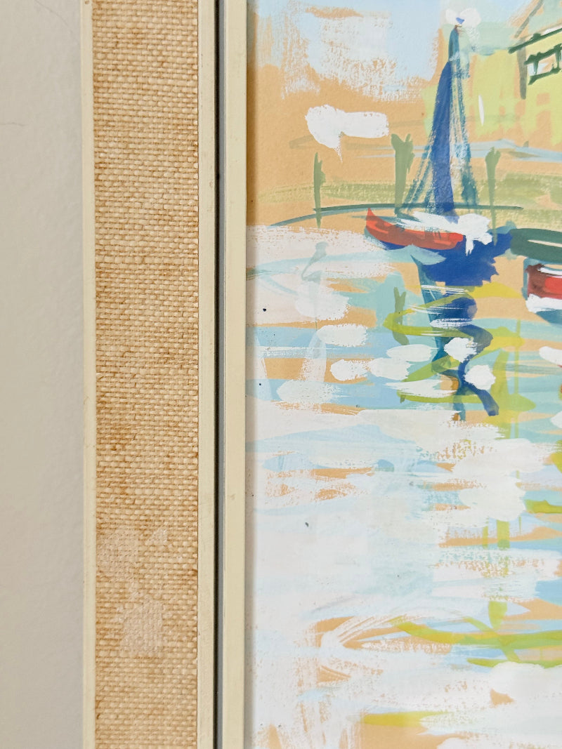Mid century harbour scene painting with pastel boats and buildings, in wooden frame, photographed on a white surface