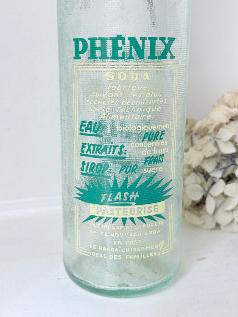 vintage french soda bottle phenix aqua green glass with ceramic swing top 31cm on white surface