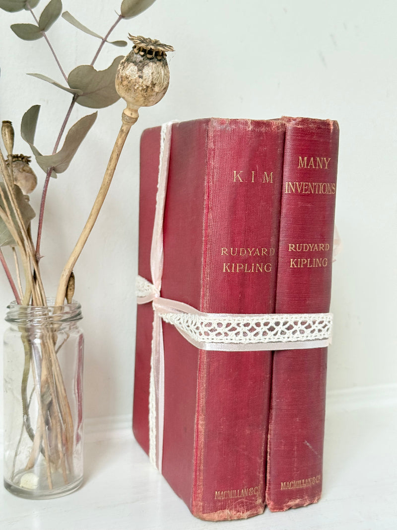 Vintage Rudyard Kipling book bundle of Kim and Many Inventions in red hardback covers, photographed on a white surface