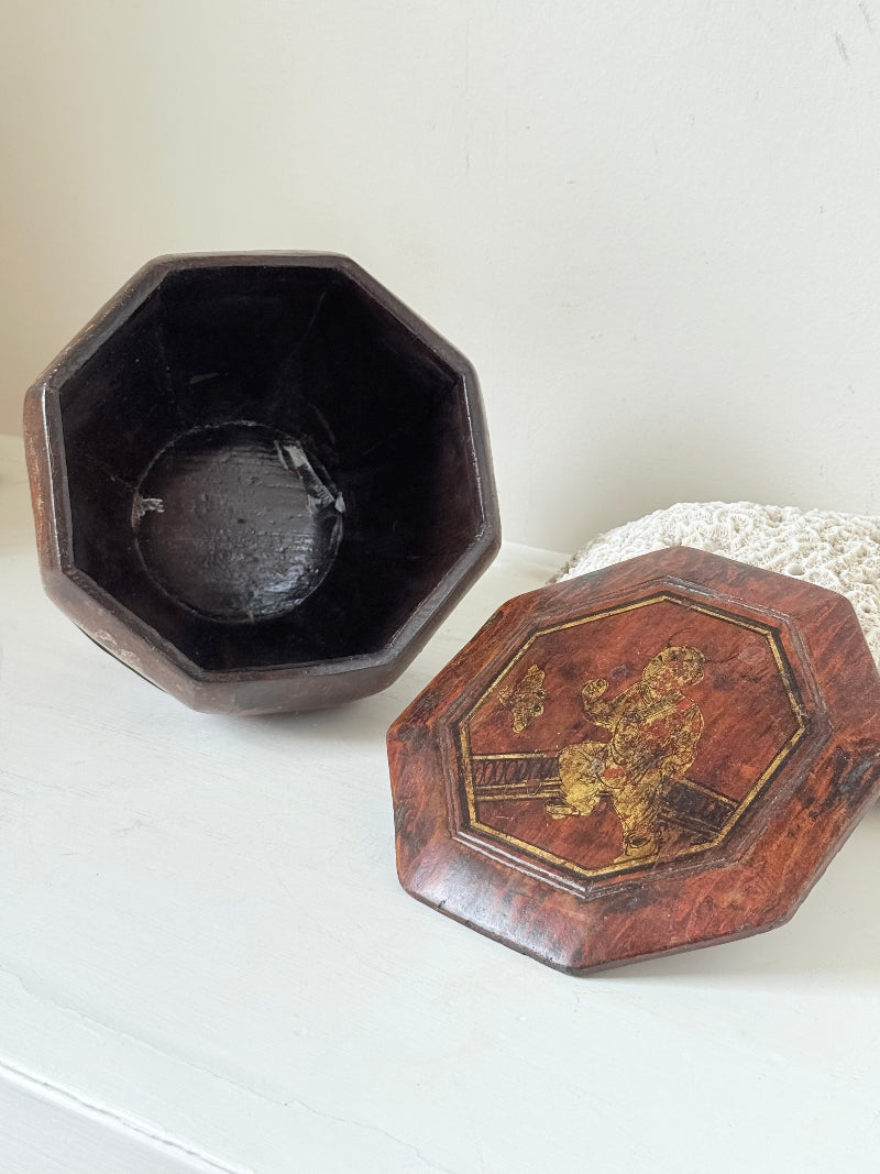 Antique octagonal Chinese lacquer basket with floral decoration and central figure, shown with lid on and off on a white surface