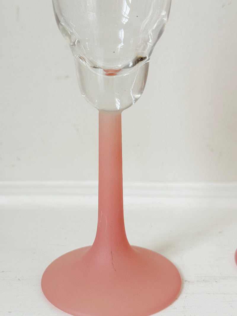 Set of five 1980s frosted pink tulip champagne flutes from the Candlelight range, photographed on a white surface