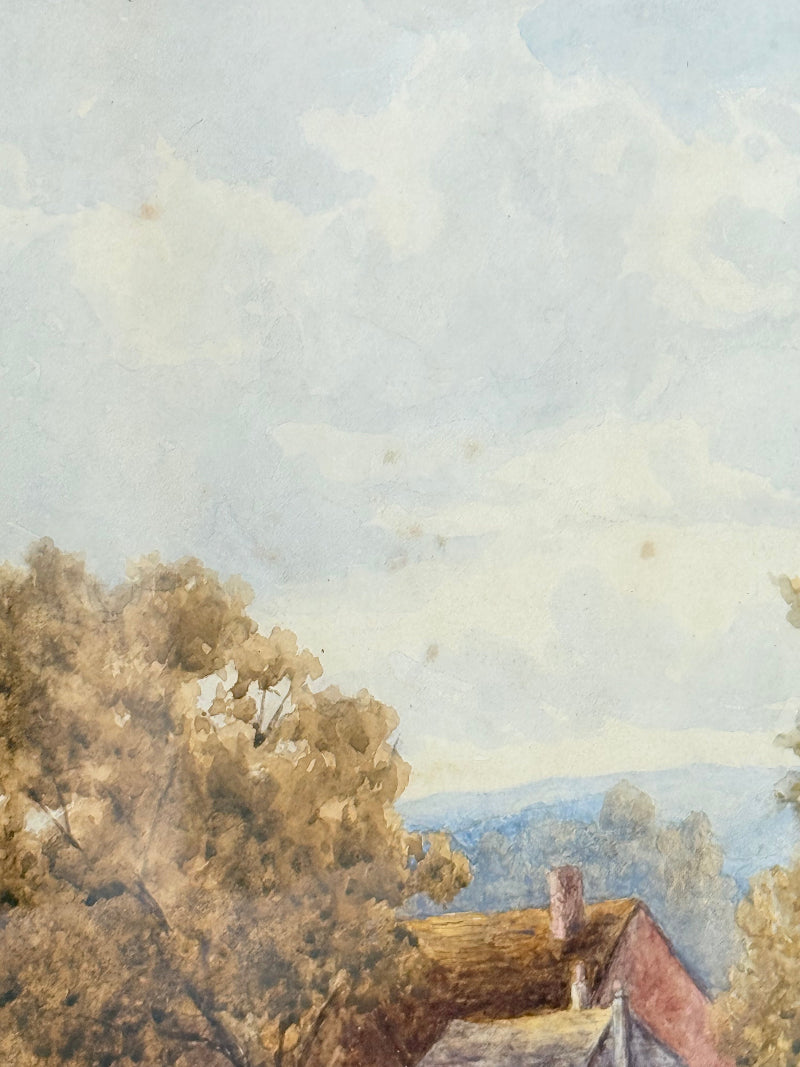 Antique watercolour landscape in gilt frame, countryside scene with trees, photographed on white surface.