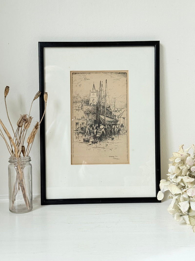 Vintage fishing harbour print in black frame, nautical scene wall art, styled on white surface with coastal decor accents
