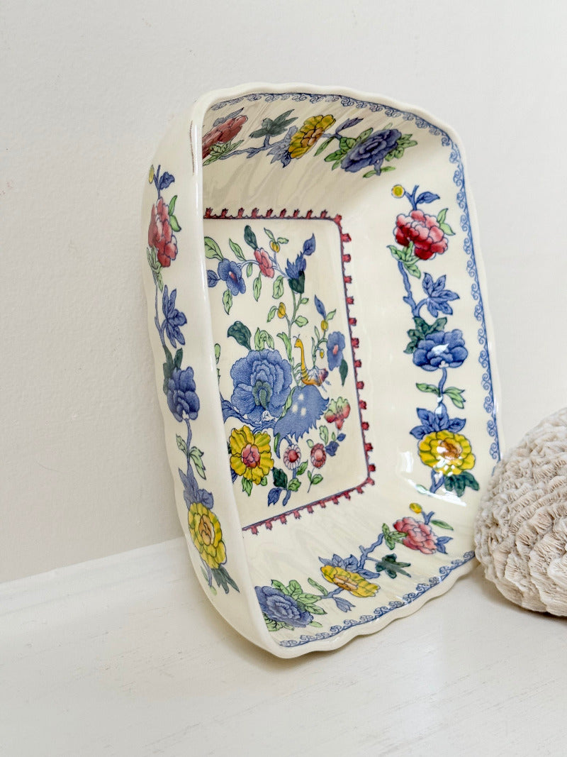 Vintage Mason’s ironstone serving dish with square form and spring floral pattern in blue, pink, yellow, and green, photographed on a white surface