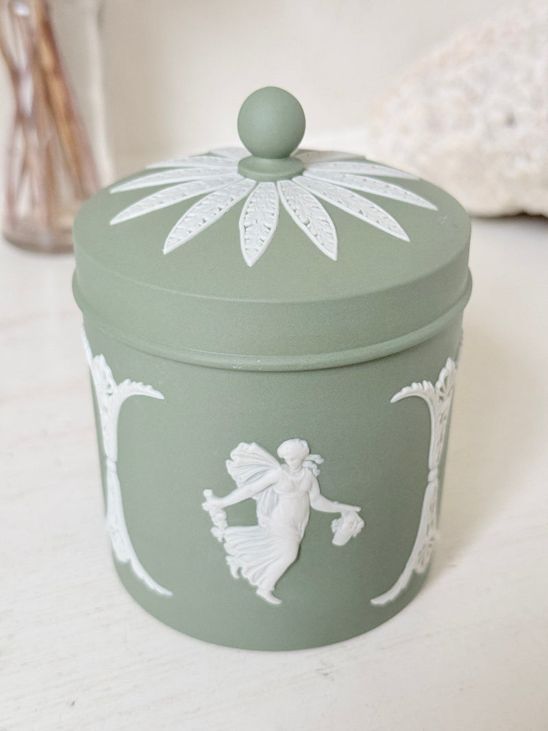 Vintage Wedgwood Jasperware sage green lidded jar with ball finial, decorated with white Dancing Hours neoclassical figures, styled with dried stems.