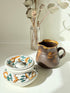 Studio pottery creamer and hand painted sugar bowl set, photographed on a white surface