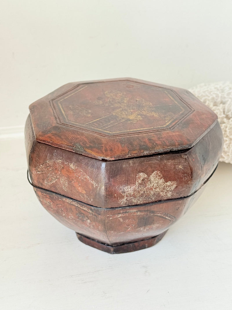 Antique octagonal Chinese lacquer basket with floral decoration and central figure, shown with lid on and off on a white surface