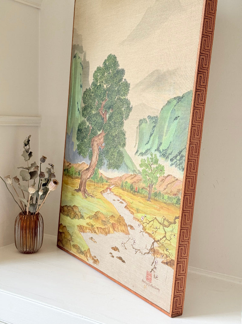 Vintage Chinese watercolour landscape on canvas with tree, mountains and blossom, photographed on white surface