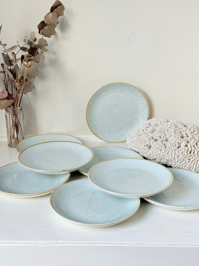Set of 8 Churchill speckled duck egg side plates with warm rim photographed on a white surface