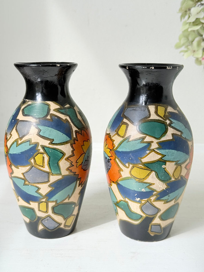 Pair of hand painted Brentleigh Ware Art Deco stoneware vases with bold floral design, photographed on a white surface
