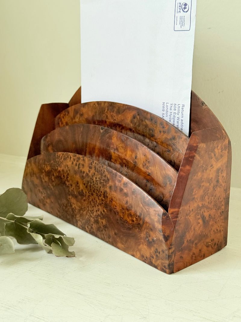 Three-slot curved letter rack made from polished burl wood with rich swirling grain, mid-century style desk organiser.
