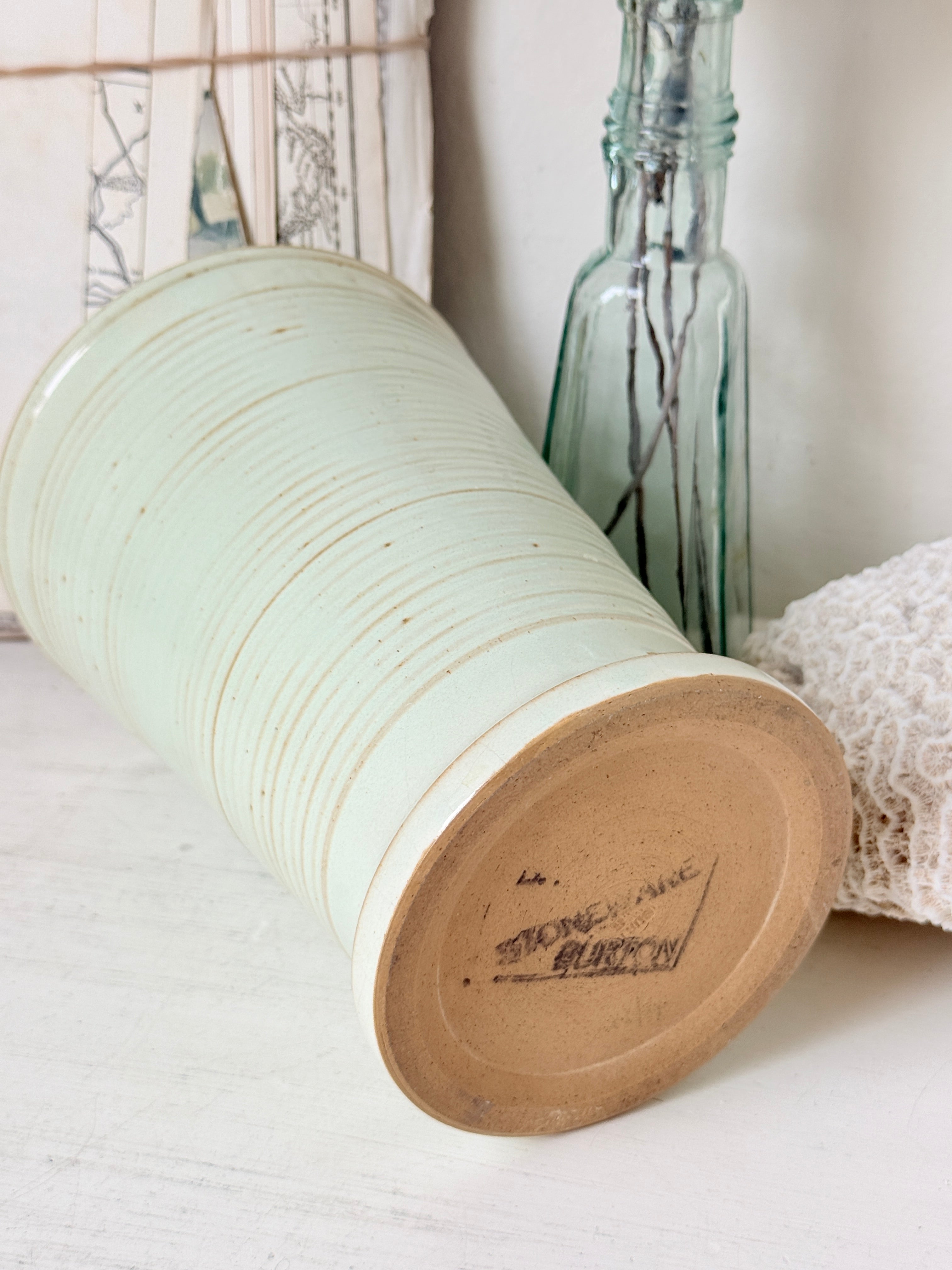 1960s Burton Ware ribbed stoneware pot in sage green, photographed on a white surface