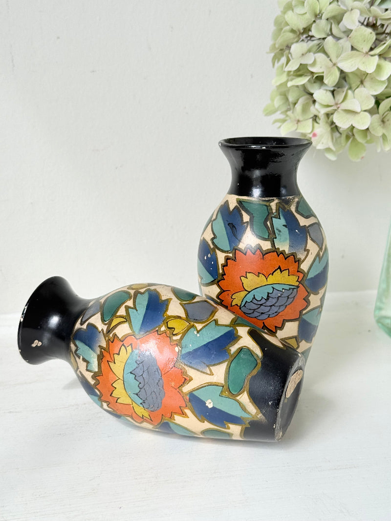 Pair of hand painted Brentleigh Ware Art Deco stoneware vases with bold floral design, photographed on a white surface