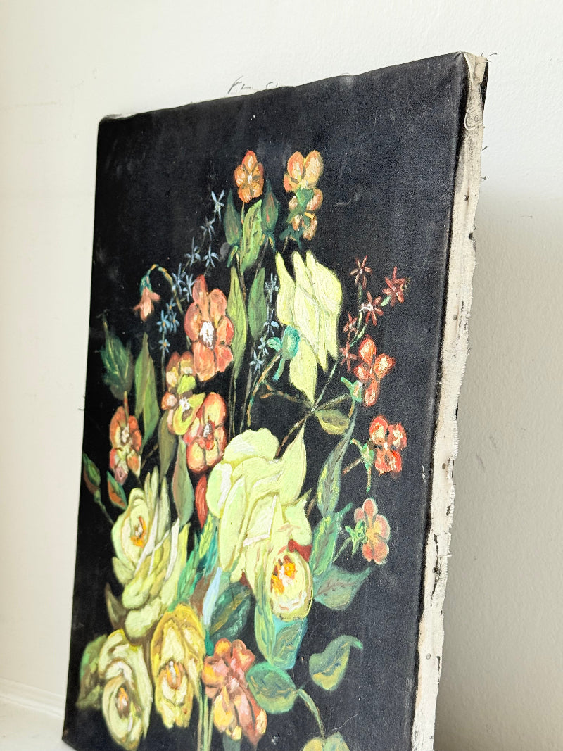 Vintage floral still life oil on canvas with yellow and peach blooms against dark background, unframed, on white surface.