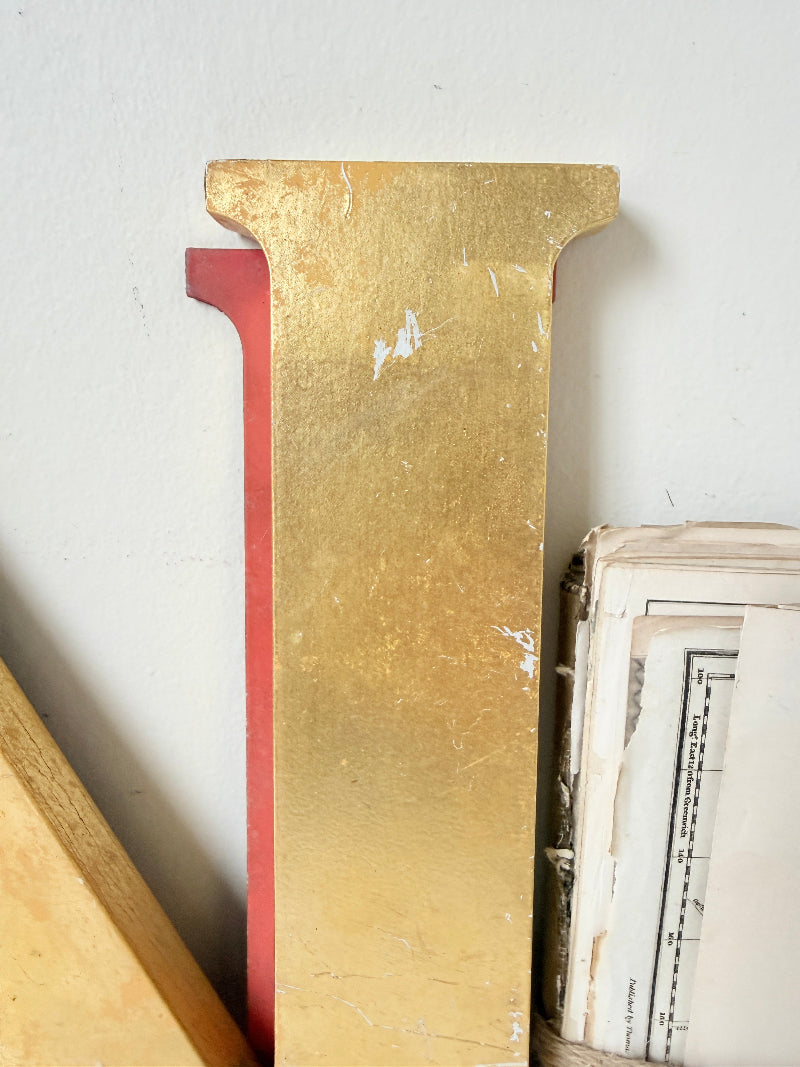 A close-up of a large decorative letter &