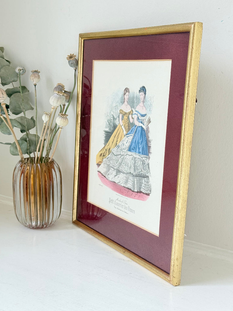 Vintage Modes de Paris fashion plate with gilt frame and burgundy mount, photographed on white surface