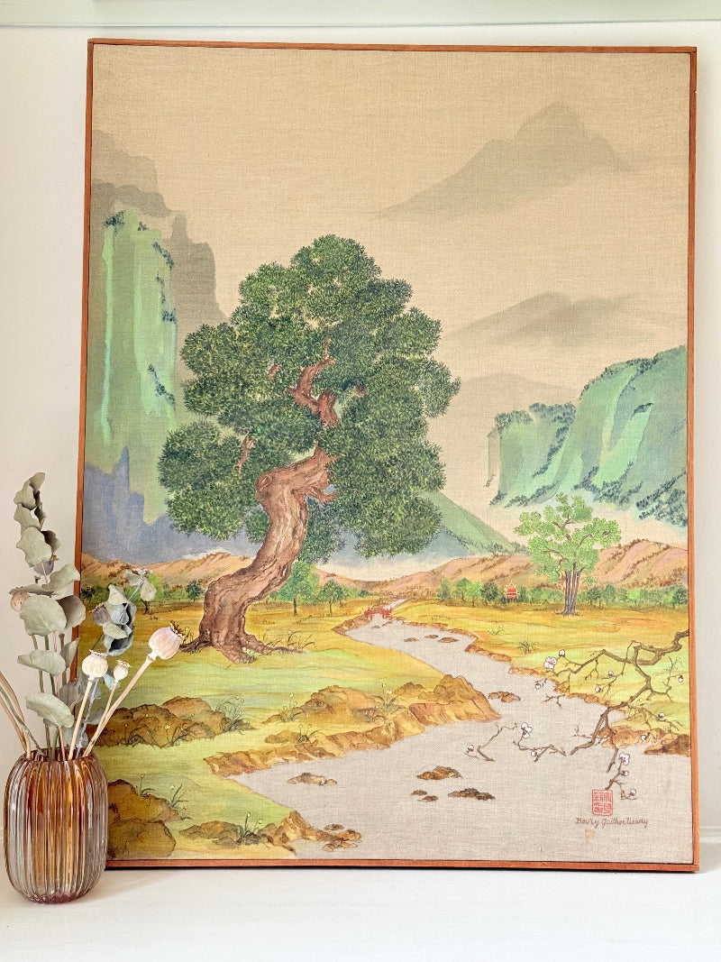 Vintage Chinese watercolour landscape on canvas with tree, mountains and blossom, photographed on white surface
