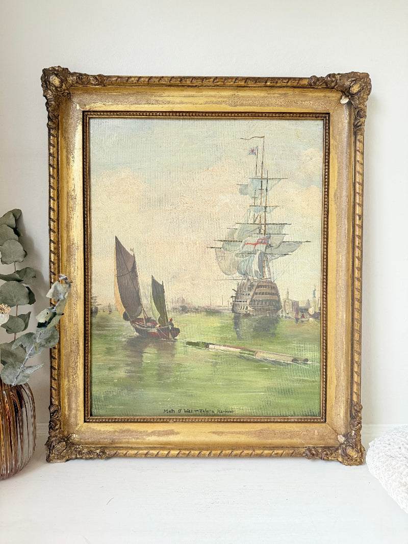 Vintage oil painting of man o’ war sailing ship with fishing boats in gilt frame