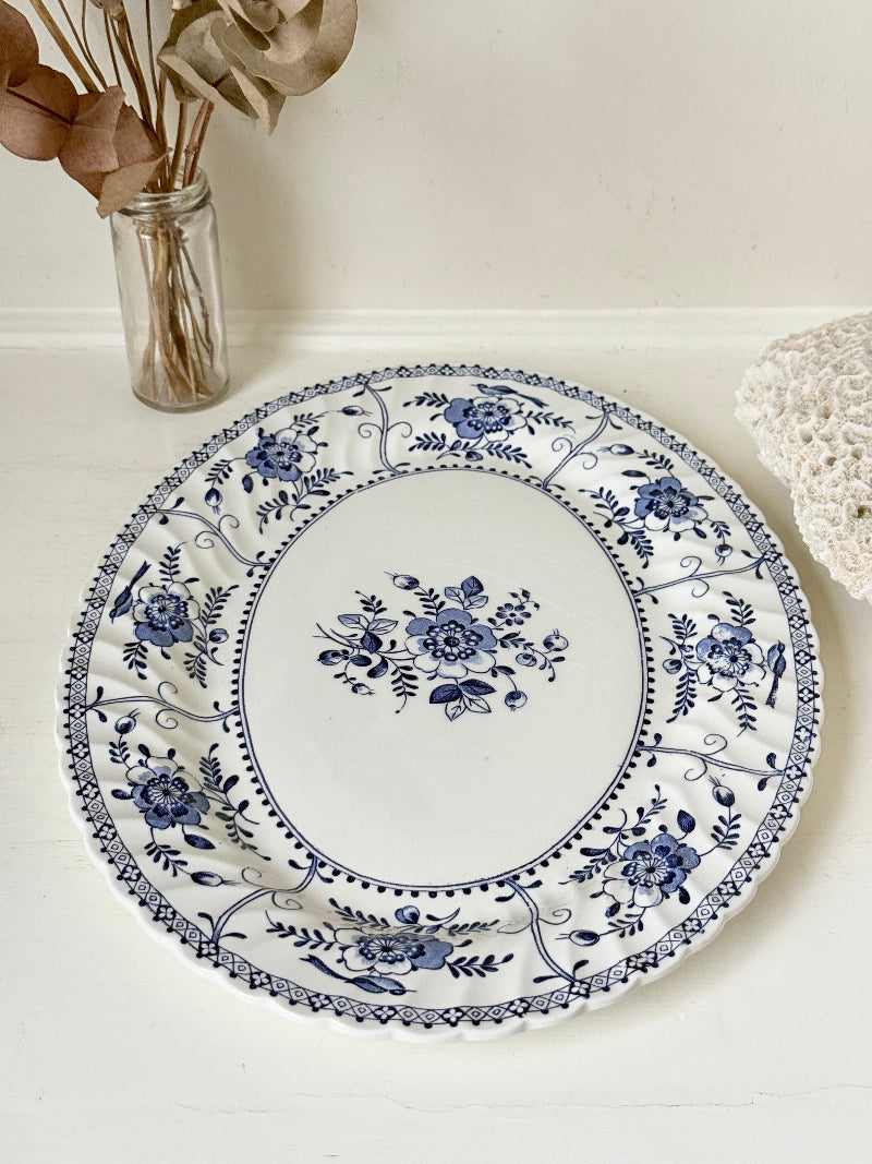 Vintage Johnson Brothers Indies blue and white oval serving platter photographed on a white surface