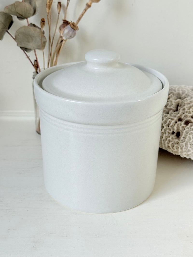Pfaltzgraff Yorktowne stoneware coffee jar with blue floral motif and lid, photographed on a white surface