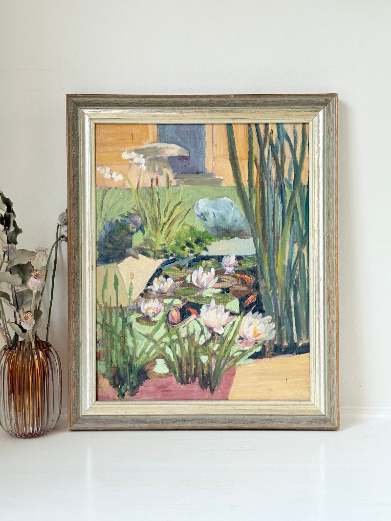 Vintage oil on board painting of waterlilies on a pond by Muriel Hester Broughton (1904–2003), monogrammed MB, framed in silver wood, photographed on a white surface