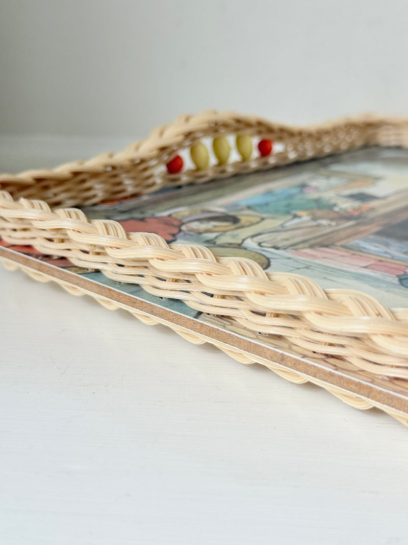 Vintage melamine tray with wicker effect edge and Victorian street scene, photographed on a white surface