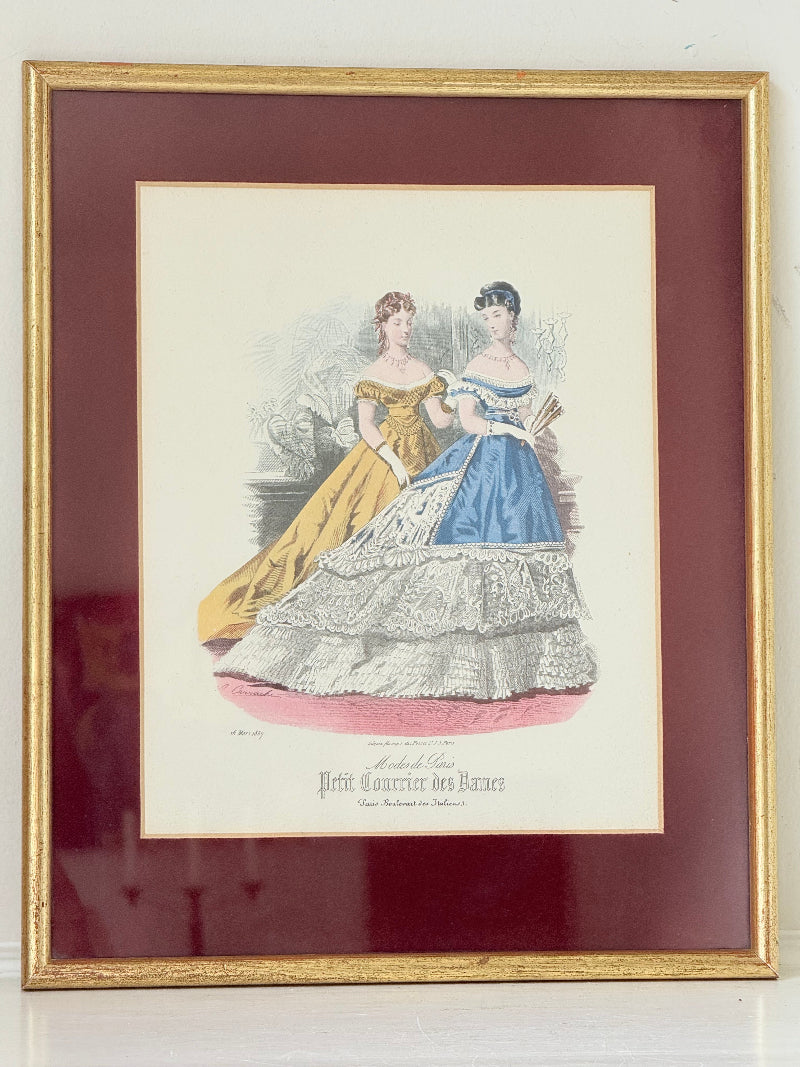 Vintage Modes de Paris fashion plate with gilt frame and burgundy mount, photographed on white surface