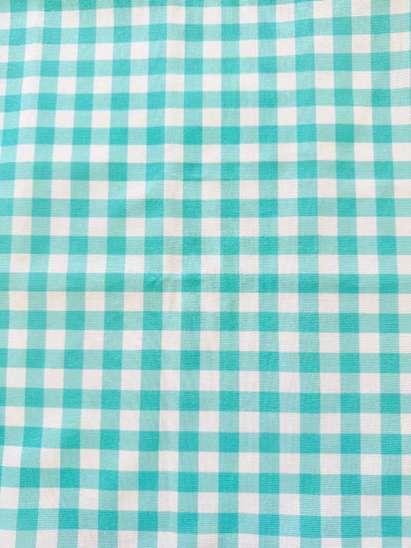 Blue Loft cotton tea towel duo with turquoise gingham check and blue toile pattern photographed in a kitchen setting.