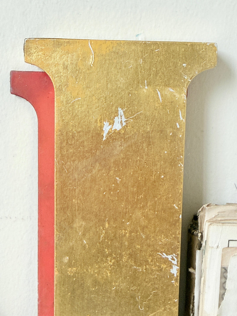 Vintage Shop Sign Letter N in Gold and Red with Serif Detail