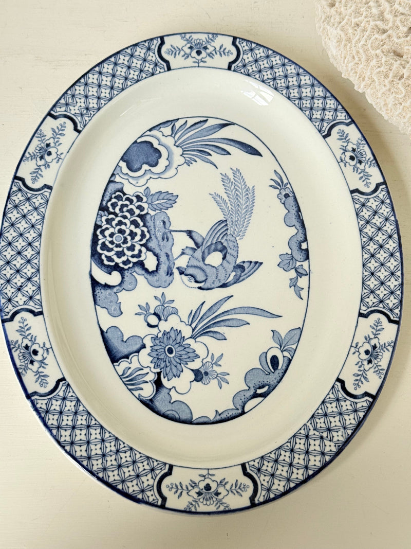 Vintage Woods and Sons Yuan blue and white serving platter photographed on a white surface