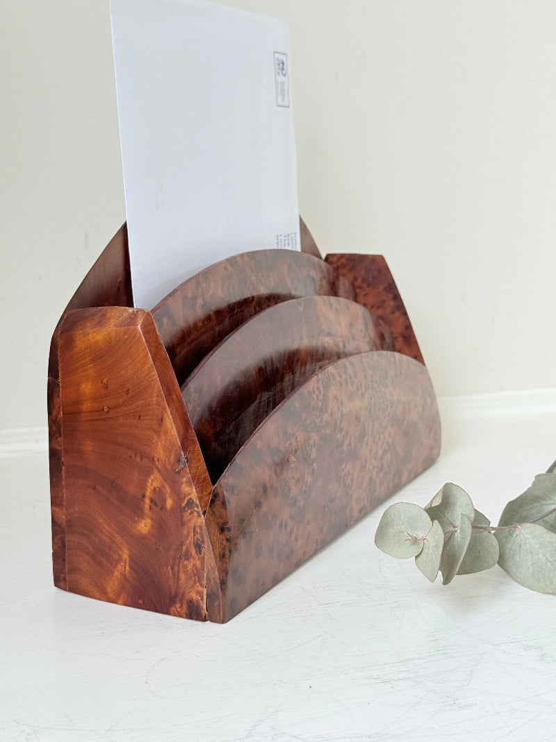 Three-slot curved letter rack made from polished burl wood with rich swirling grain, mid-century style desk organiser.