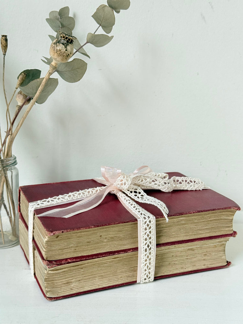 Vintage Rudyard Kipling book bundle of Kim and Many Inventions in red hardback covers, photographed on a white surface