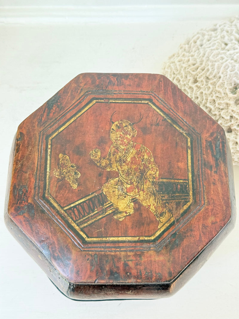 Antique octagonal Chinese lacquer basket with floral decoration and central figure, shown with lid on and off on a white surface
