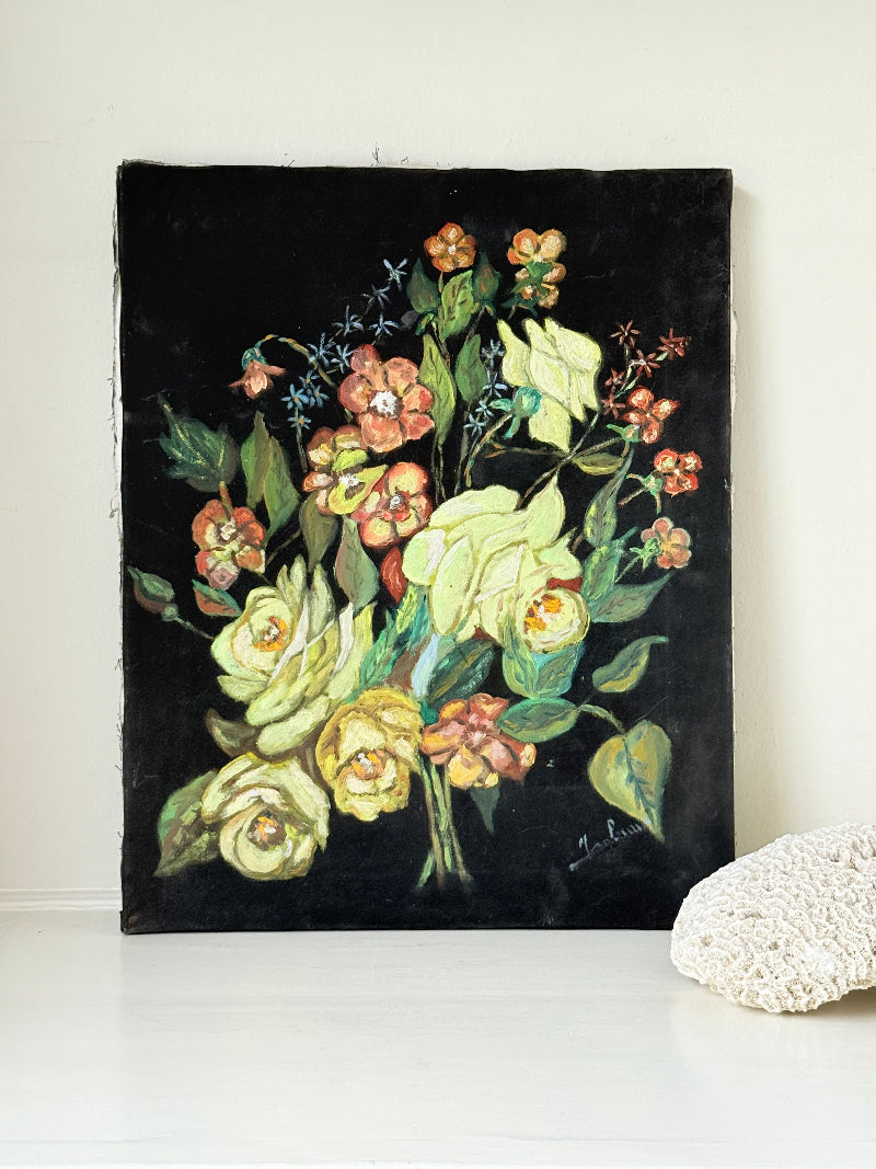 Vintage floral still life oil on canvas with yellow and peach blooms against dark background, unframed, on white surface.
