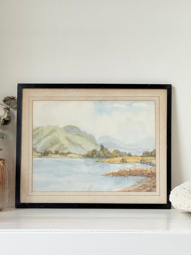 Vintage signed watercolour landscape of mountains and lake in black frame