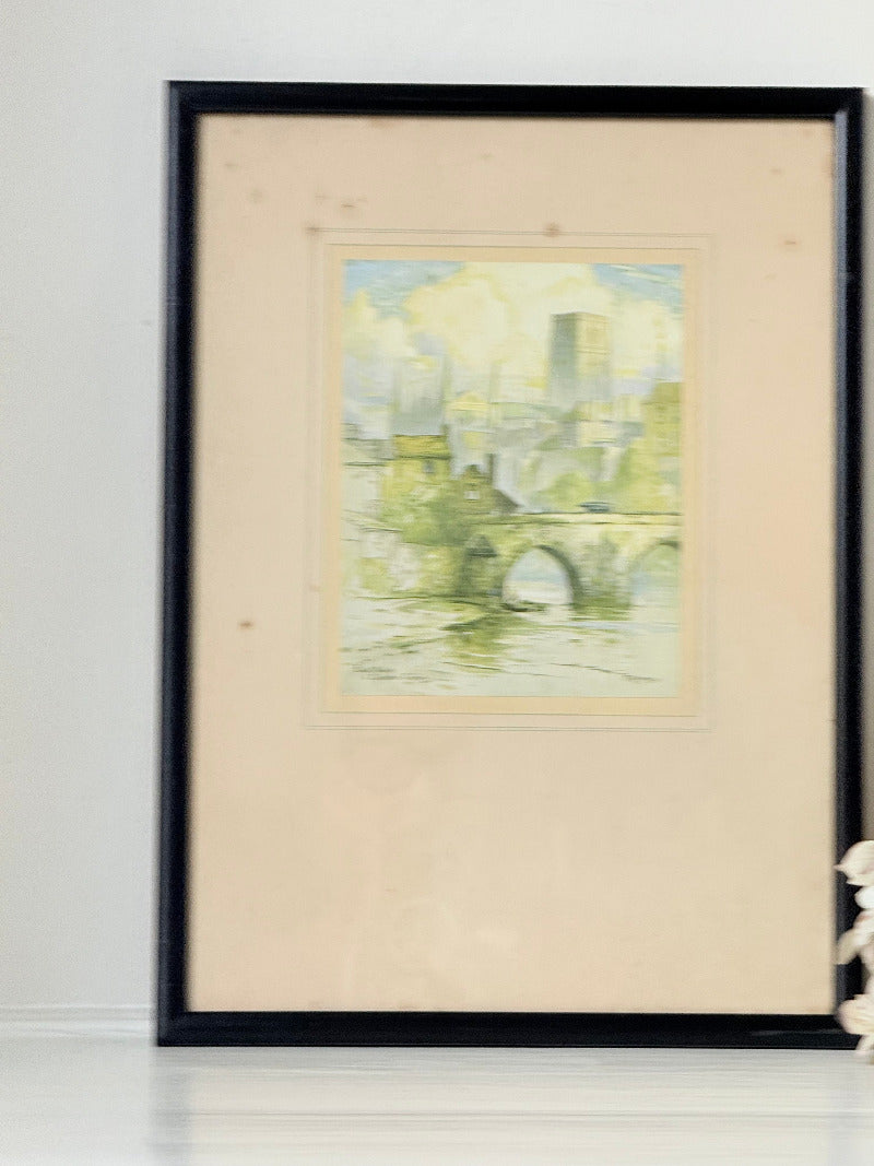 framed print of durham cathedral and elvet bridge with soft green and yellow tones photographed on white surface