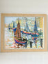 Mid century harbour scene painting with pastel boats and buildings, in wooden frame, photographed on a white surface