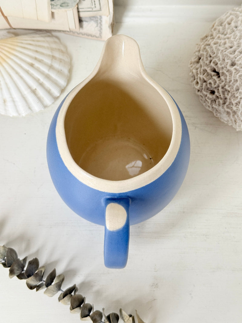 Vintage cornflower blue glazed stoneware jug with cream interior, pulled spout and curved handle for kitchen styling