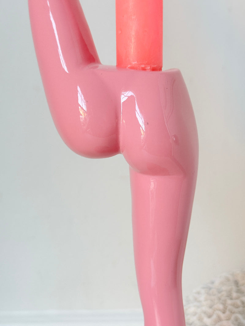 Anissa Kermiche Can Can Candlestick in Shine Pink resin with sculptural kicking leg design and taper candle