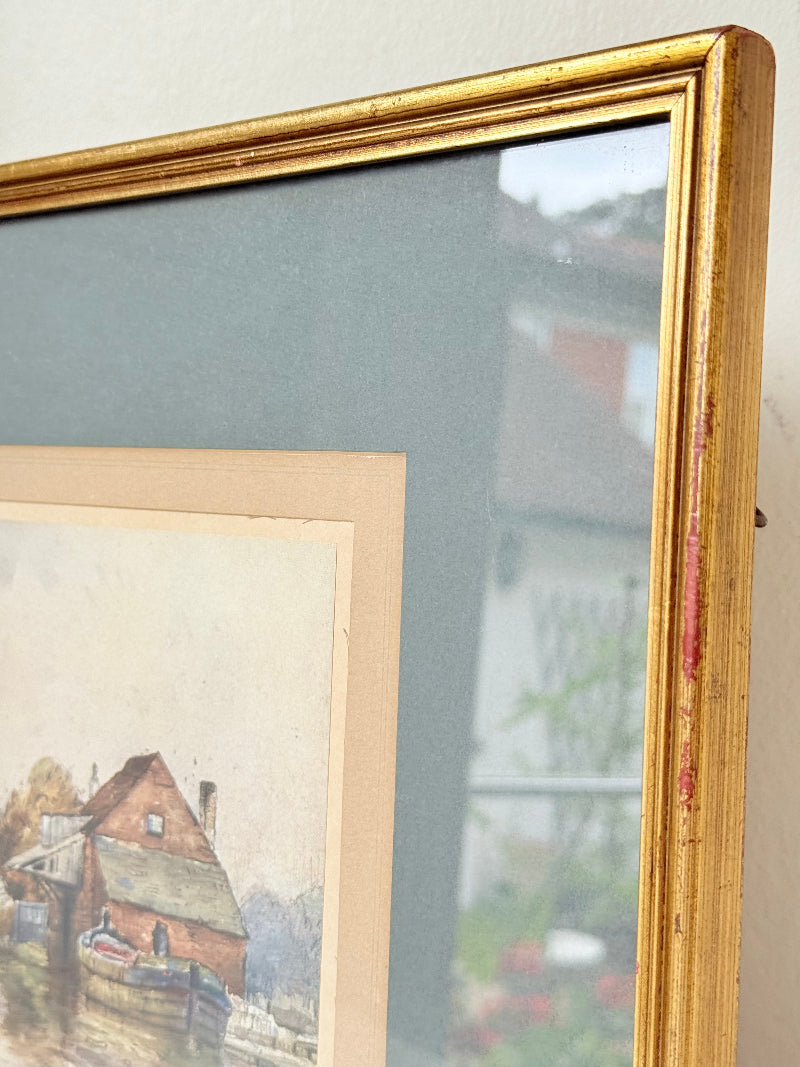 Vintage framed print of riverside mill by F Robson, gilt frame with blue mount, rustic water scene, photographed on white surface.