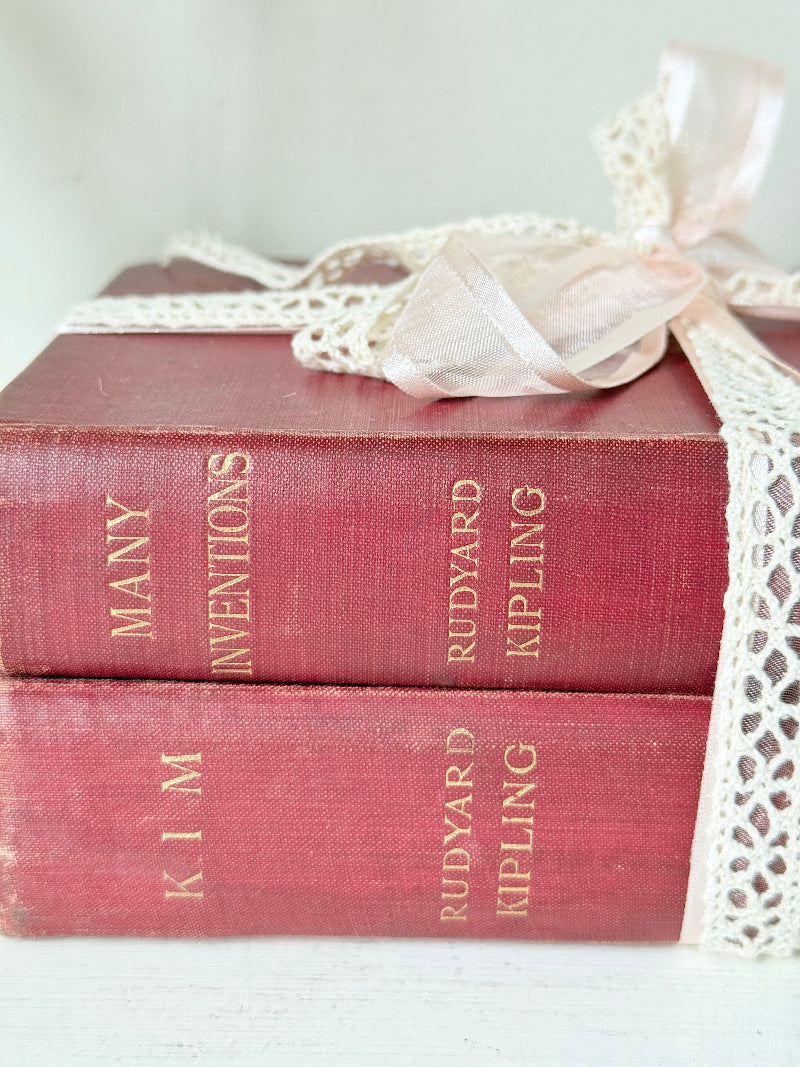 Vintage Rudyard Kipling book bundle of Kim and Many Inventions in red hardback covers, photographed on a white surface