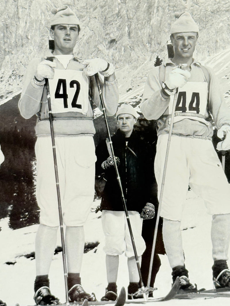 Vintage black and white framed photograph of the 1st Battalion Irish Guards Ski Team, 1963–64, posed in full ski gear against the Austrian Alps.