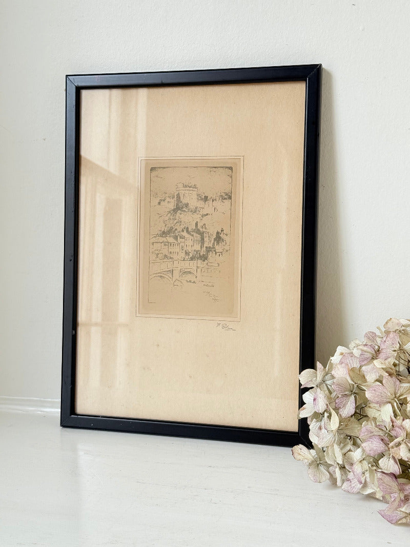framed print of windsor castle viewed from the thames with fine line detail photographed on white surface