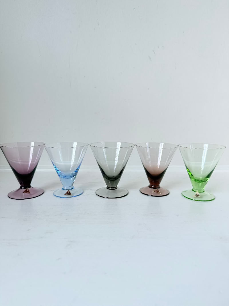 Set of five mid century German martini glasses in coloured glass with ombré effect, photographed on a white surface