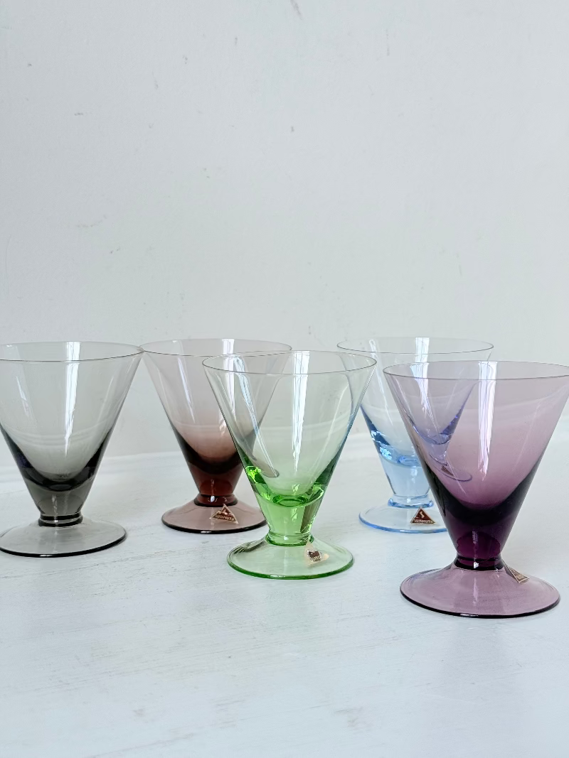 Set of five mid century German martini glasses in coloured glass with ombré effect, photographed on a white surface