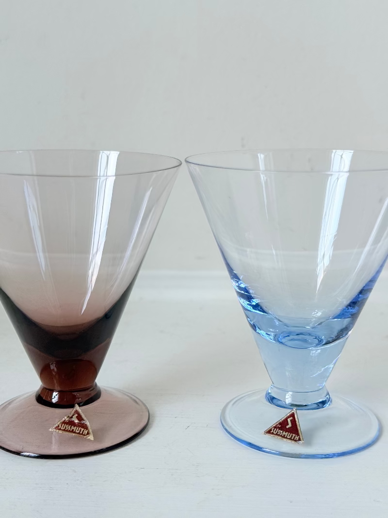 Set of five mid century German martini glasses in coloured glass with ombré effect, photographed on a white surface