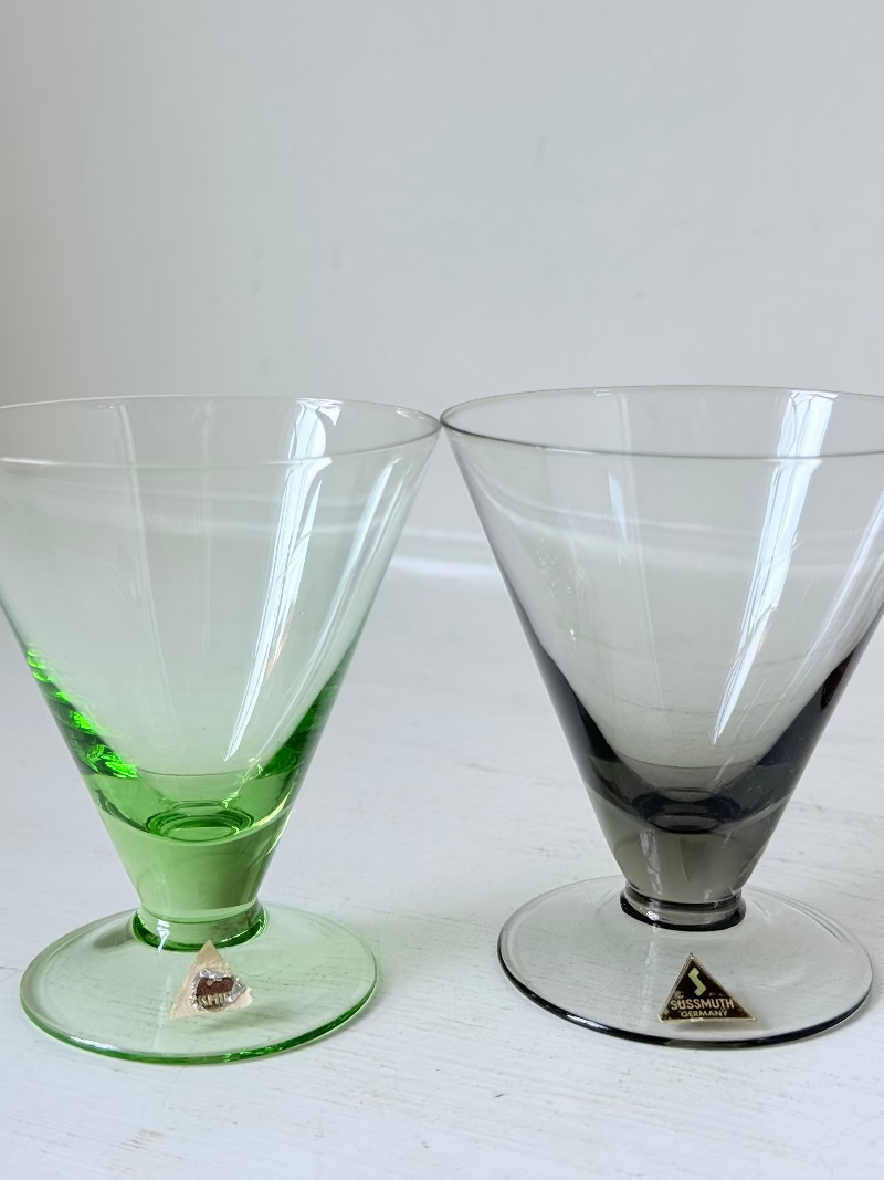 Set of five mid century German martini glasses in coloured glass with ombré effect, photographed on a white surface